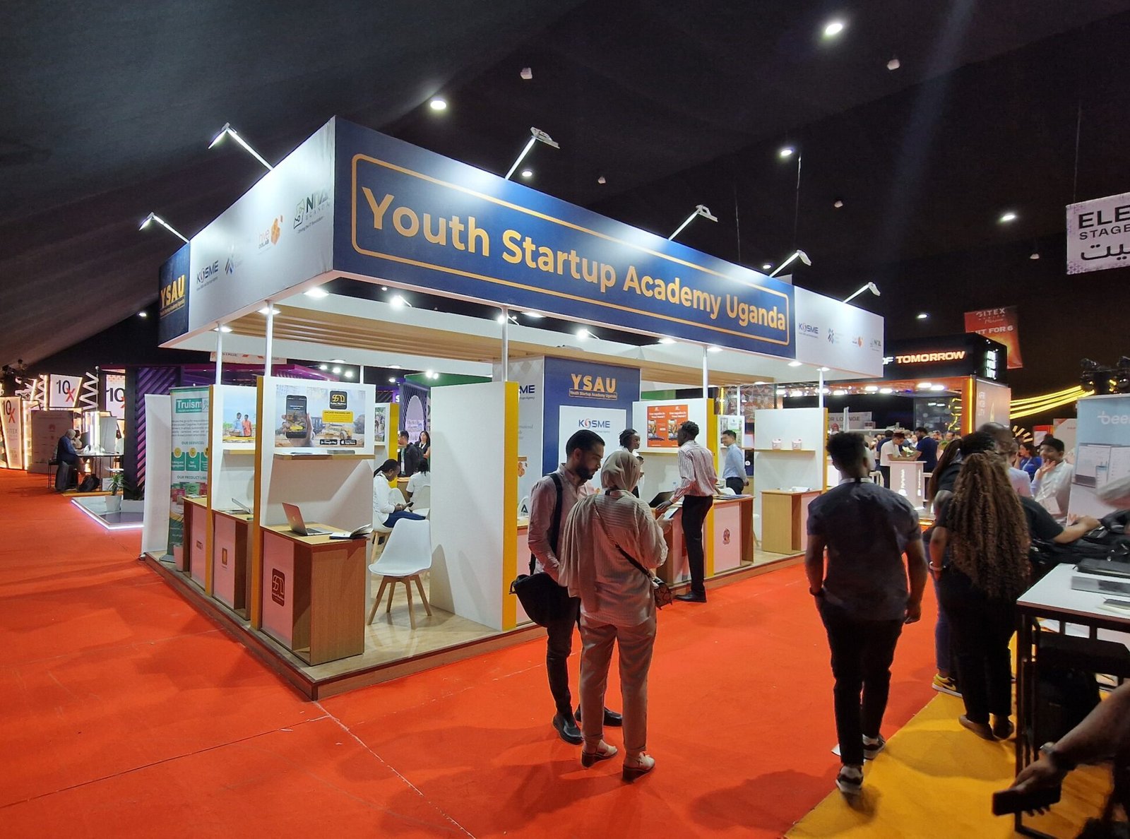 Stand builder in Dakar installing exhibition booth