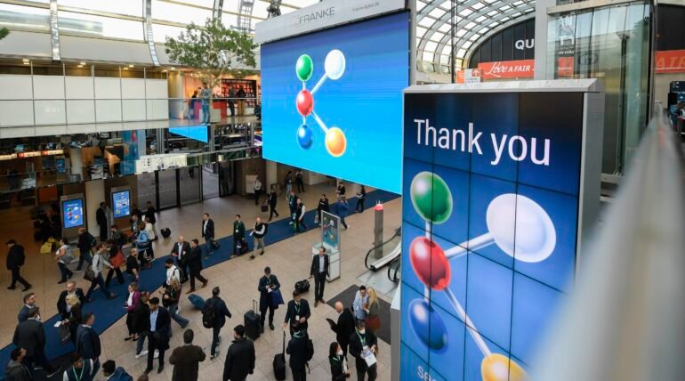 Custom-designed exhibition booth at K 2025 in Düsseldorf by ExhibitStandBuilder.